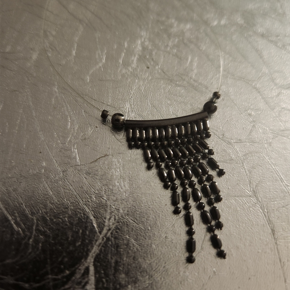 Invisible floating gunmetal bead necklace